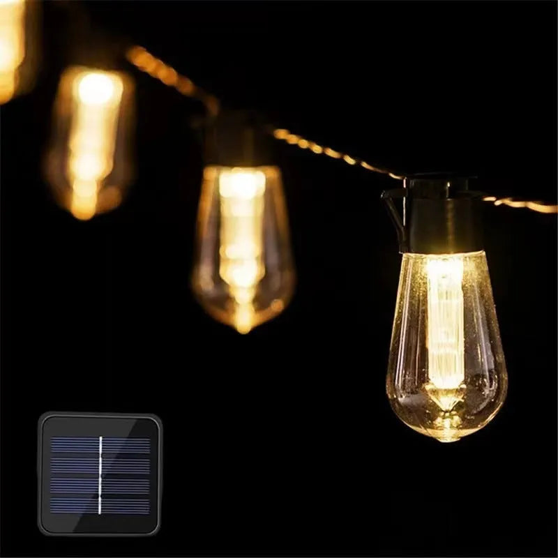 Retro glass infusion bottle shaped outdoor string lights on a patio