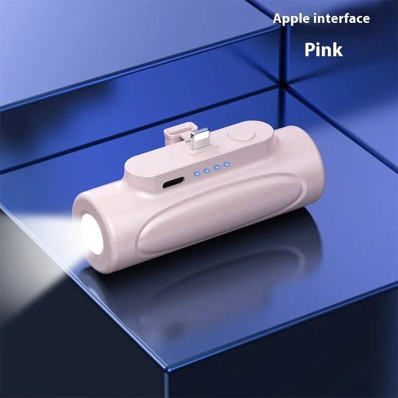 Black and pink creative power bank with built-in LED flashlight, showing Type-C and Apple port options.
