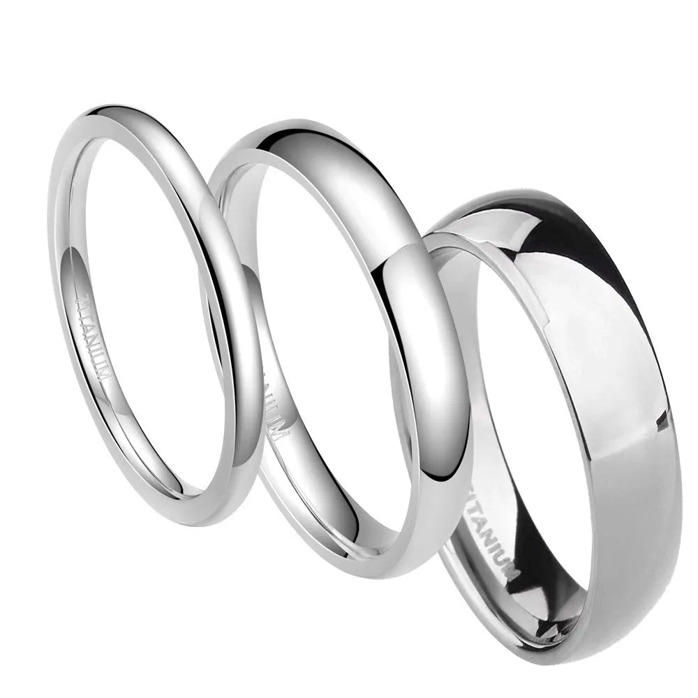 Silver coloured titanium steel unisex ring shown in 2mm, 4mm, and 6mm band width options.