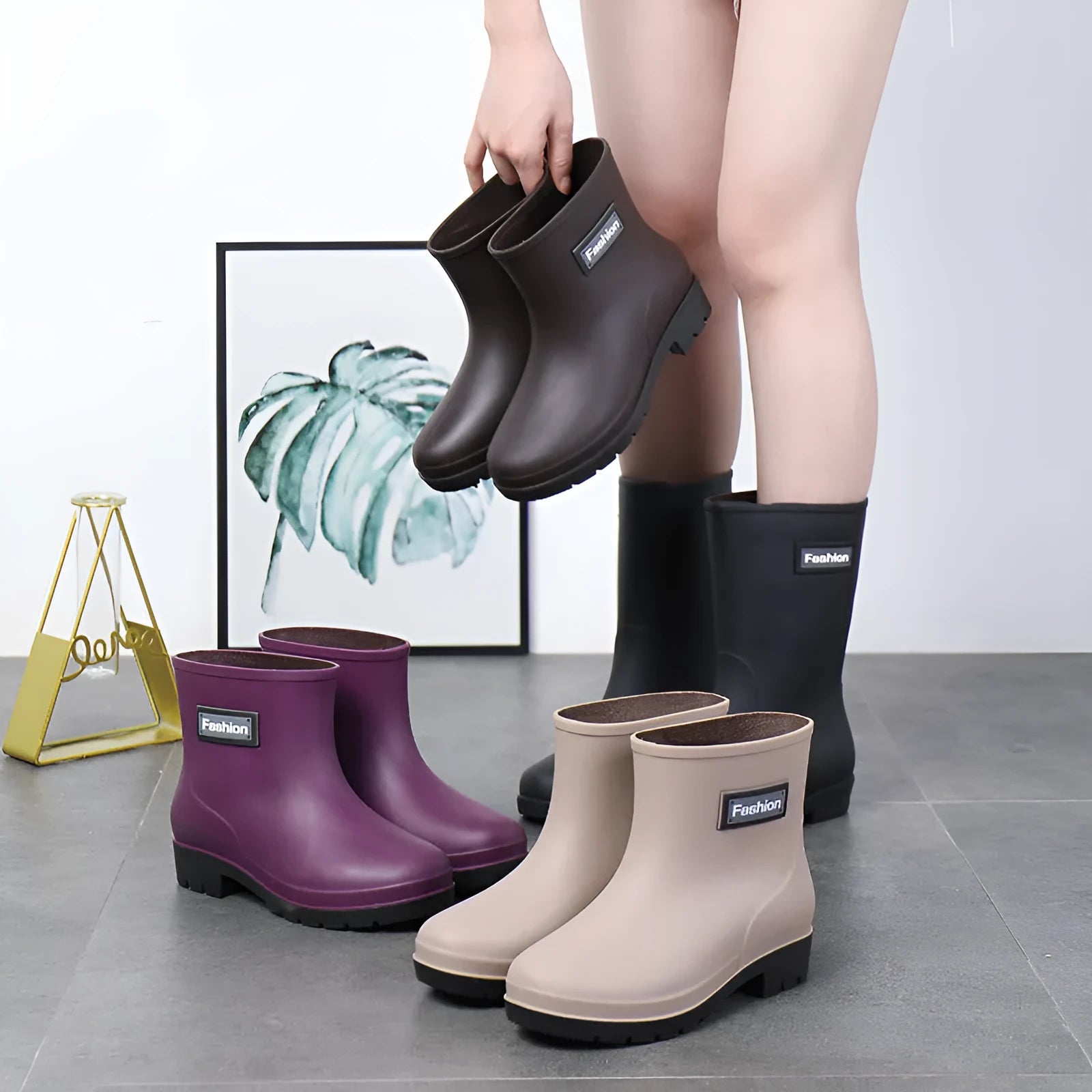 Women's mid-calf PVC rain boots in black, shown with a low heel and optional warm lining.