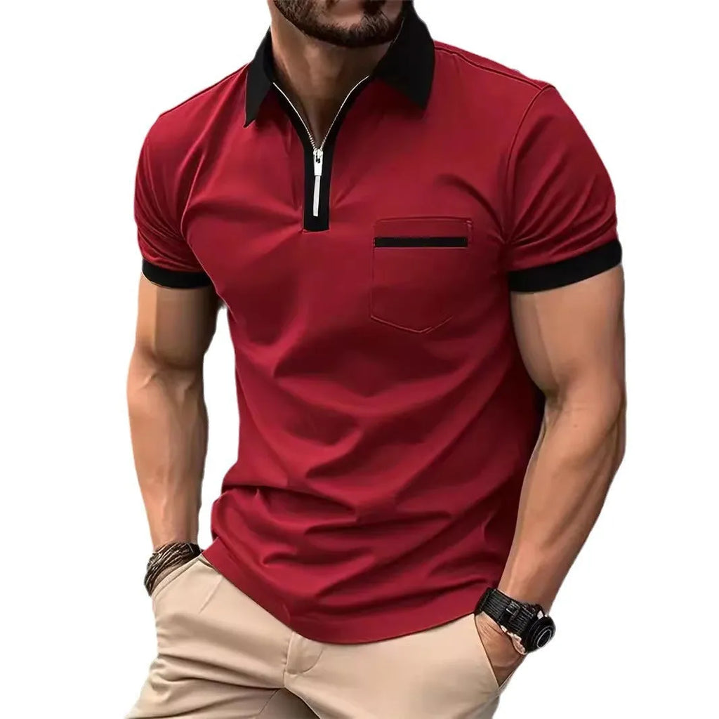 Man wearing a loose-fit short sleeve casual shirt with a chest pocket and zipper detail.