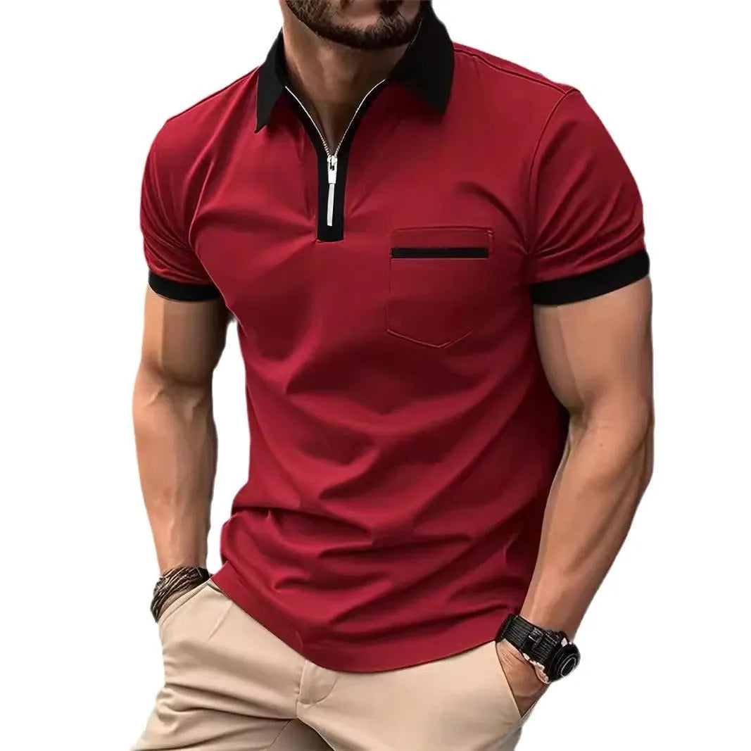 Man wearing a loose-fit short sleeve casual shirt with a chest pocket and zipper detail.