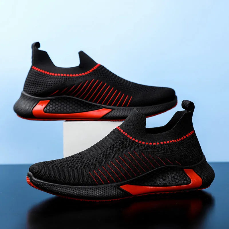Men's black and white striped mesh sock sneakers with lace-up front and round toe.