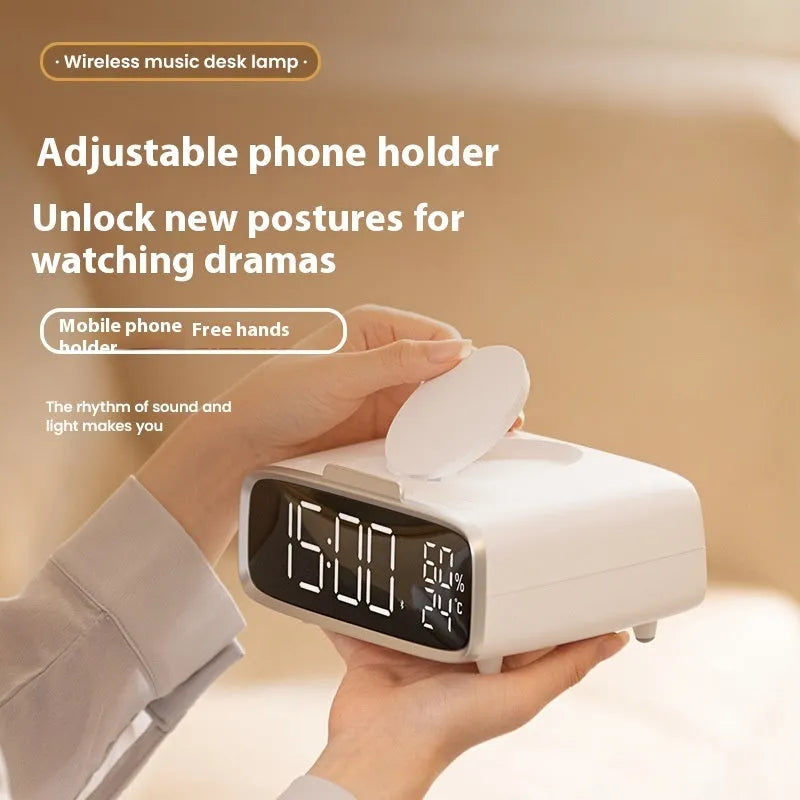 White wireless charging Bluetooth speaker with night lamp functions on bedside table