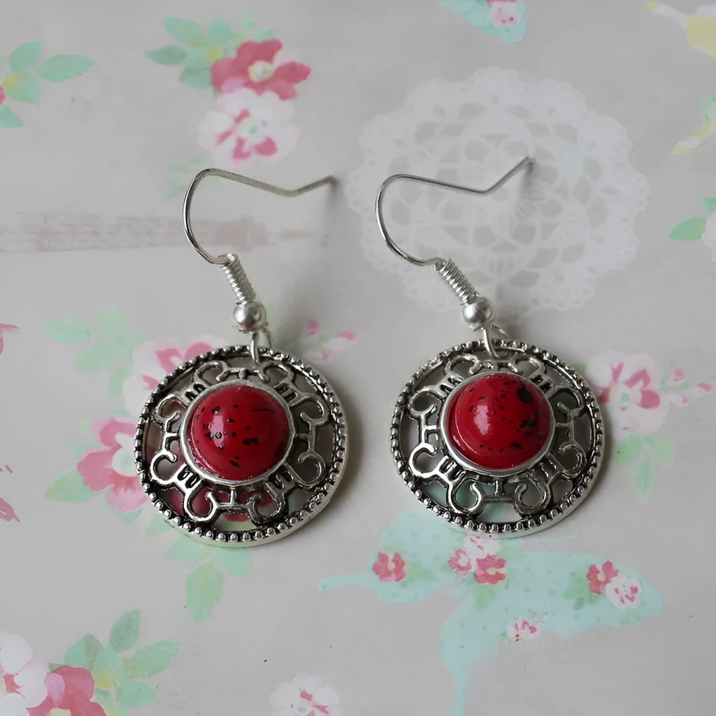 Handmade Miao silver and turquoise geometric flower disk earrings with ethnic patterns.