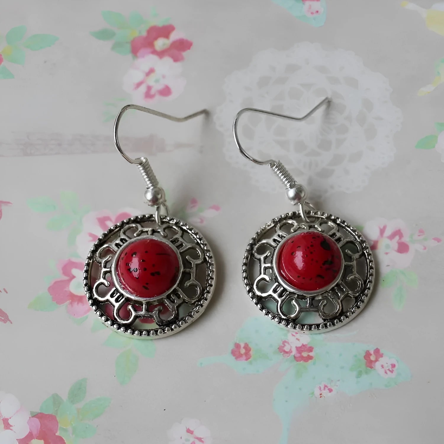 Handmade Miao silver and turquoise geometric flower disk earrings with ethnic patterns.