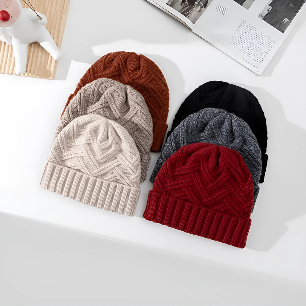 Wool knitted dome crown beanie hat for women in ankela red with a totem pattern.
