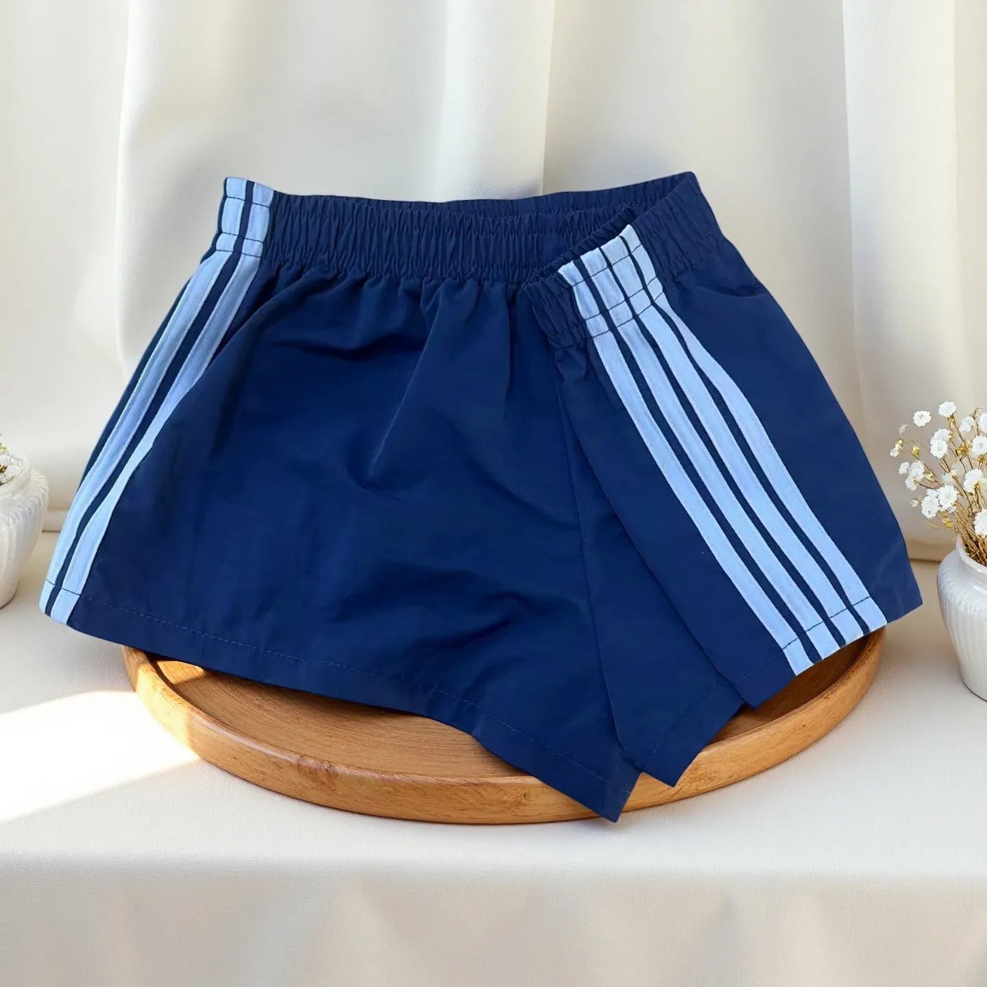 Navy blue men's nylon sport shorts with high-waist elastic waistband