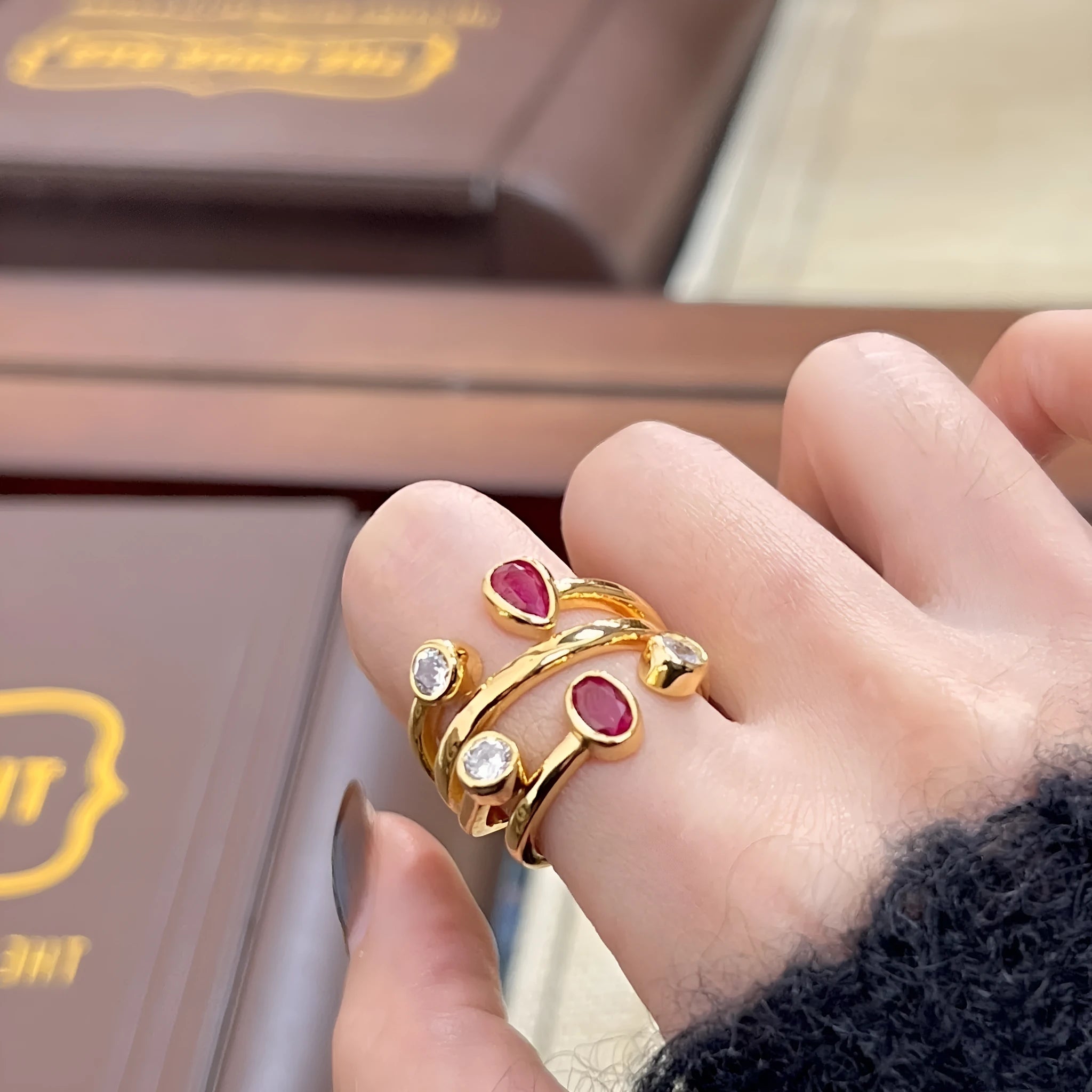 Geometric retro-style ring with an irregular cross design set with diamonds, in two-tone colours.