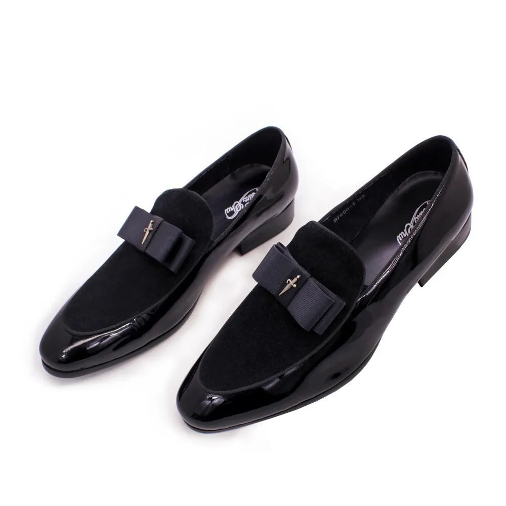Men's glossy black patent leather low-top shoes featuring a gold tassel detail on a white background.