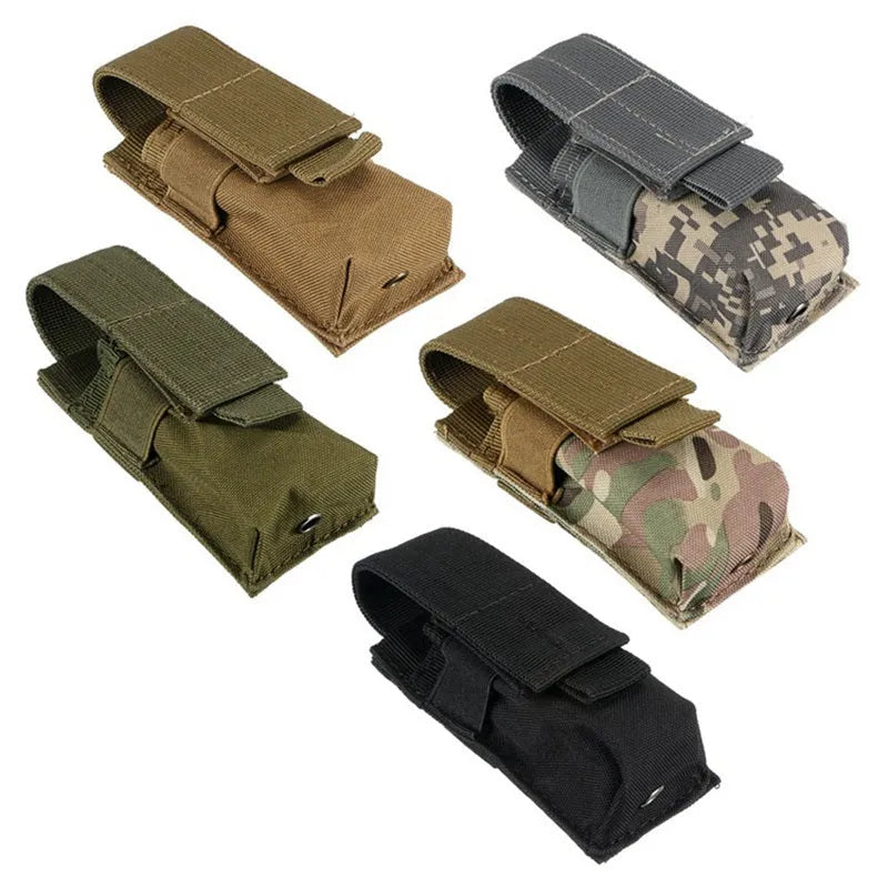 Black MOLLE-compatible tactical waist pouch with elastic cord closure, shown next to a pistol magazine.