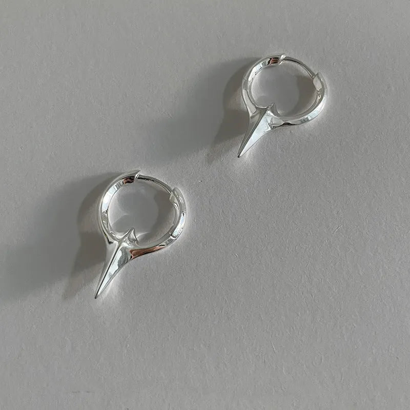 Geometric star-shaped ear clips for women with white gold plating in platinum colour