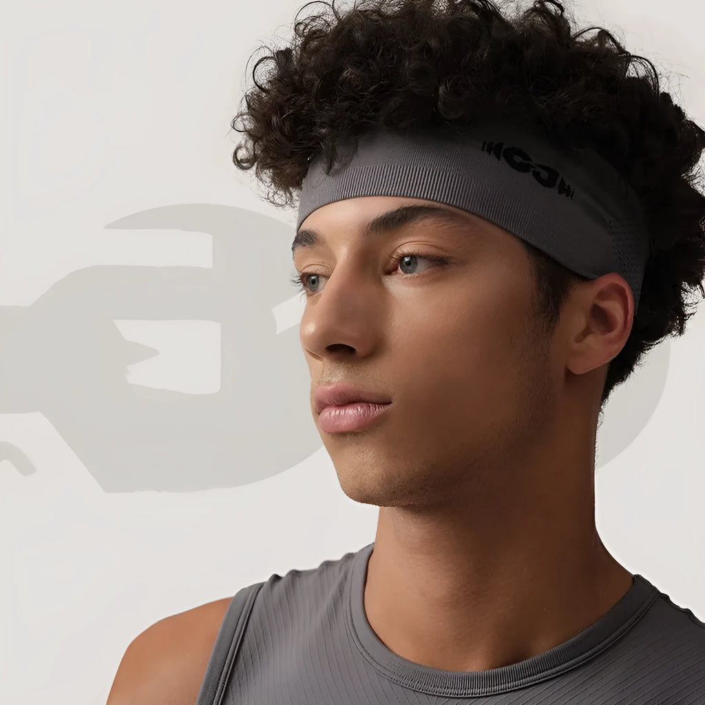 Seamless knitted stretch hair band for sports in black, grey and blue colours.