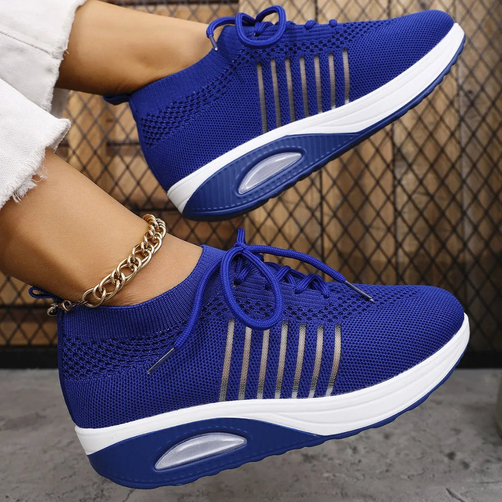 Women's lace-up slip-on wedge sports shoes in black with mesh upper and mid heel height increase