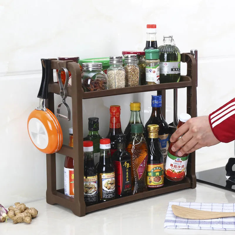 Foldable kitchen storage rack with multilayer shelves in white colour on countertop