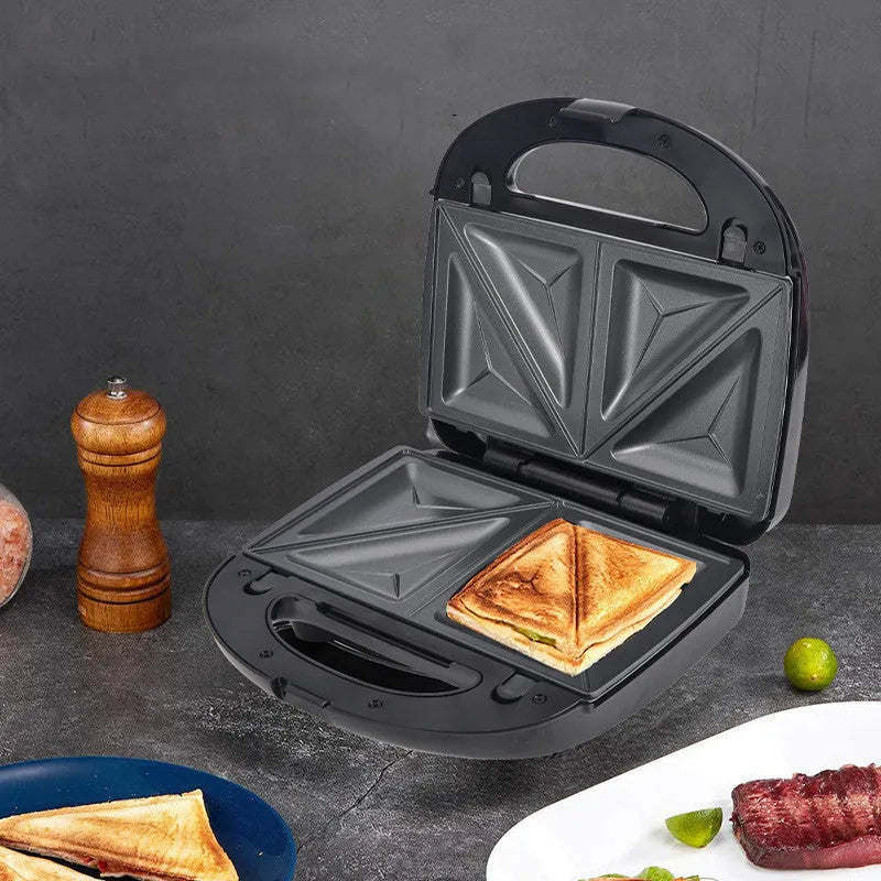 Black double-sided electric sandwich maker with stainless steel lid and six round non-stick cooking plates.