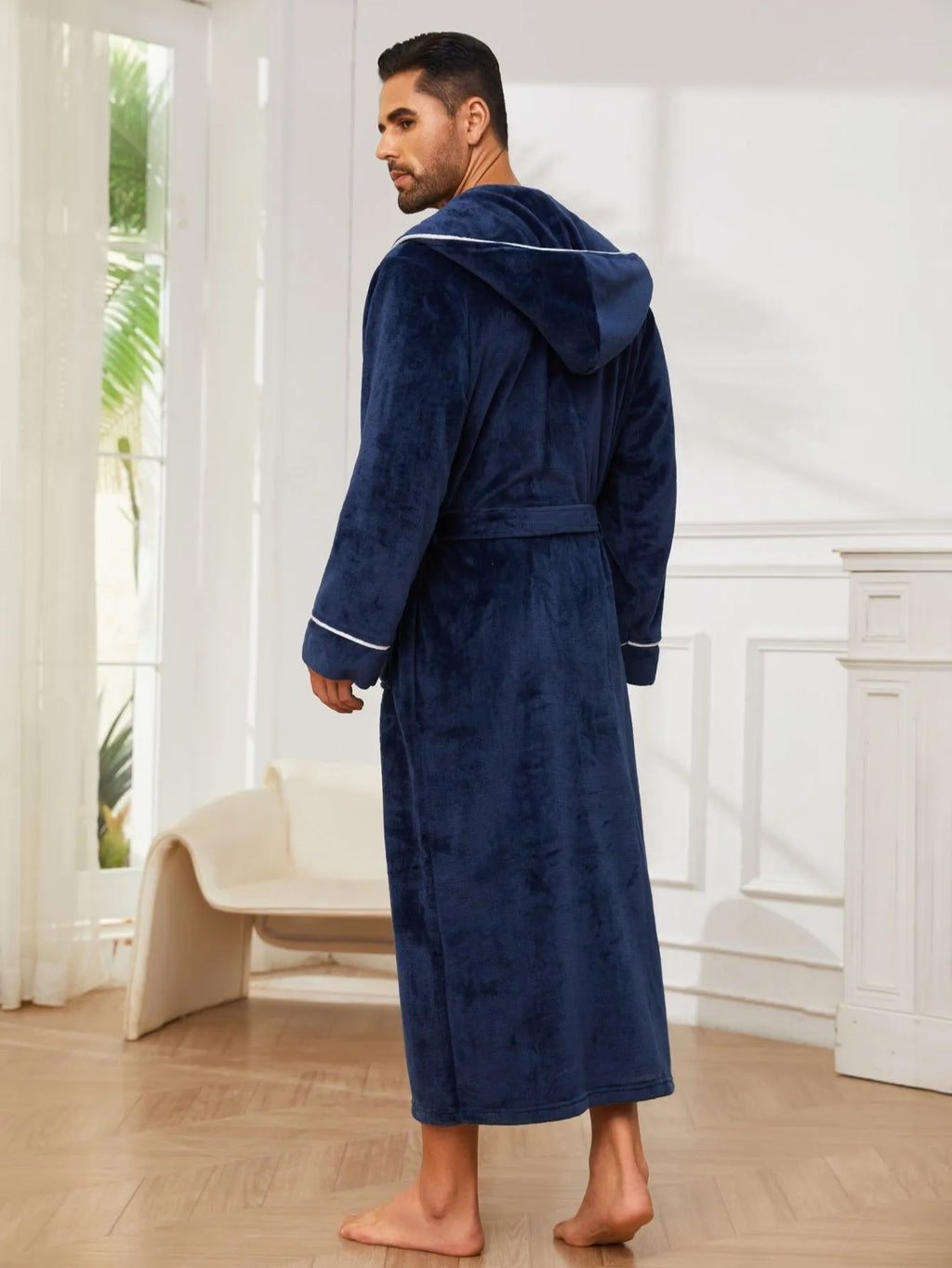Man in a grey flannel bathrobe, European style, for winter home wear.