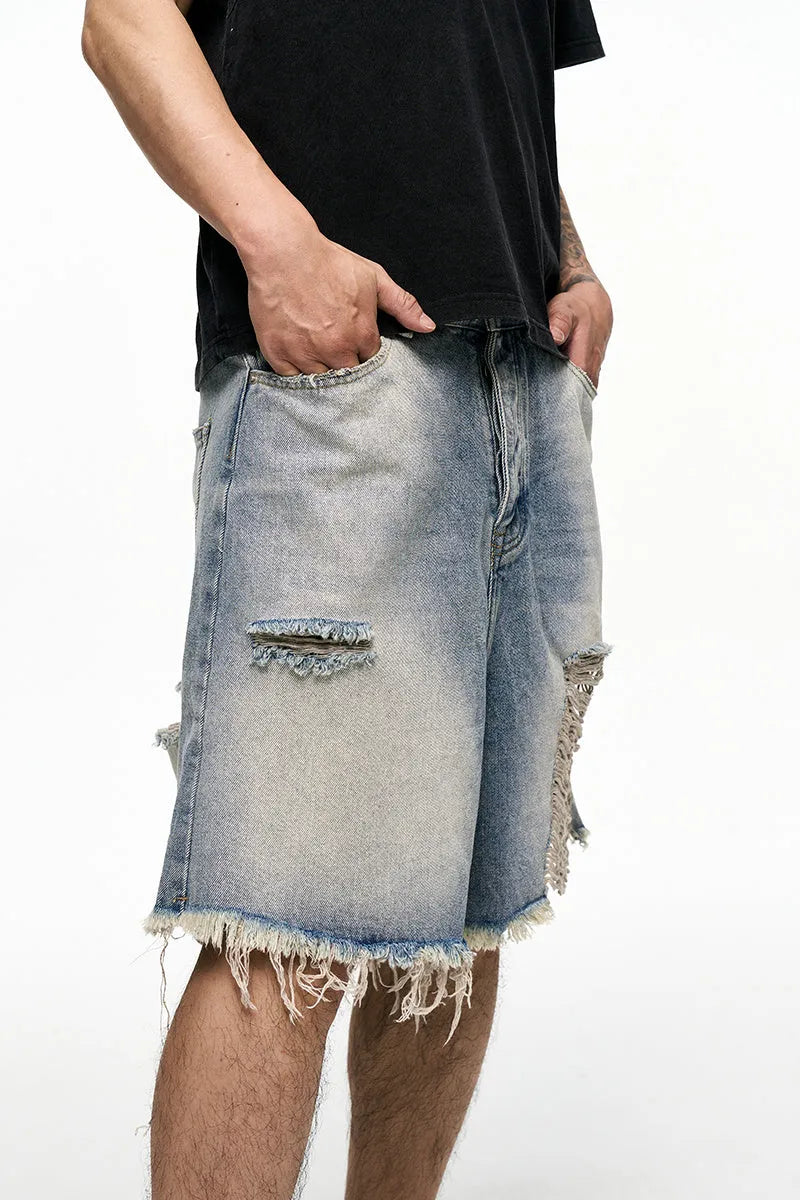 Men's light blue retro washed baggy denim shorts on a hanger