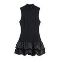 Women's black cotton short dress with lace stitching and asymmetric skirt on a plain background
