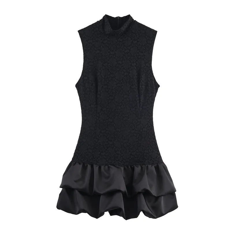 Women's black cotton short dress with lace stitching and asymmetric skirt on a plain background