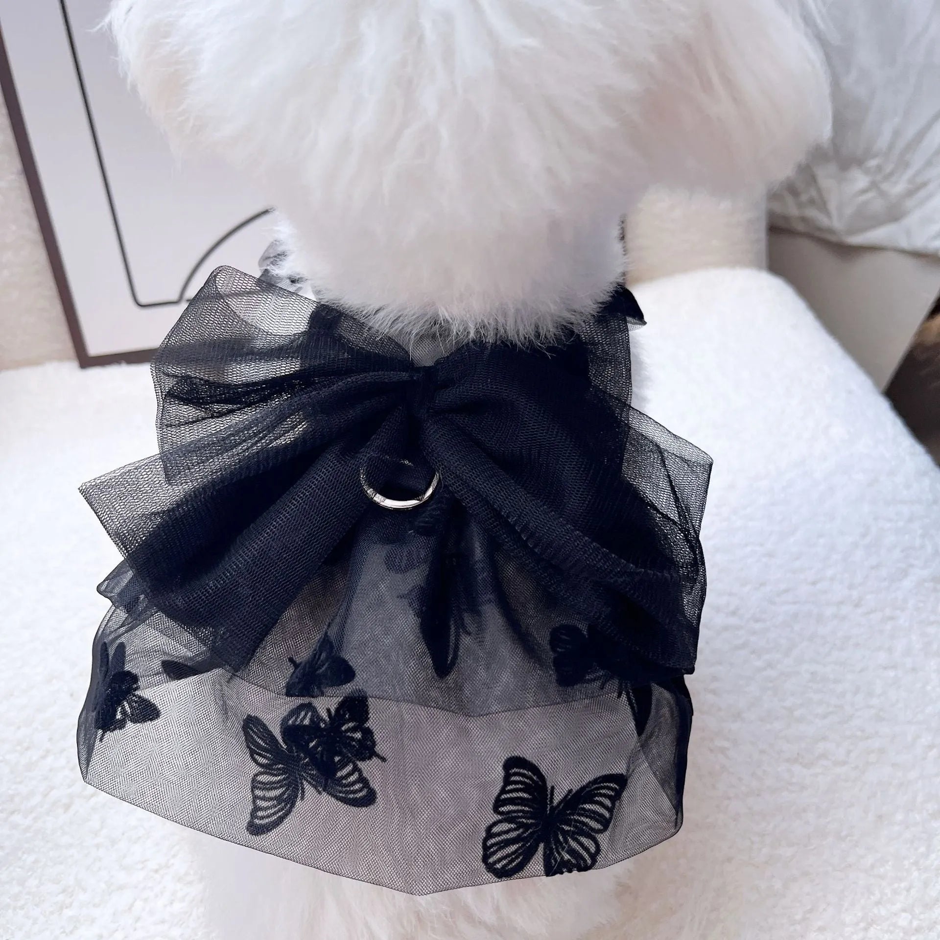Black gauze princess skirt for a small dog on a mannequin, showing tulle material.