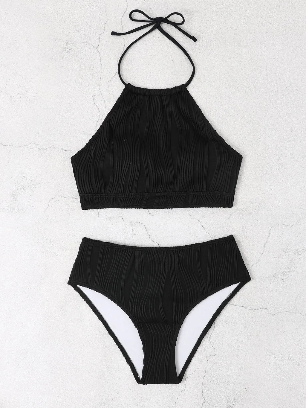 Women's high-waist apron-style conservative two-piece swimsuit in a solid colour.