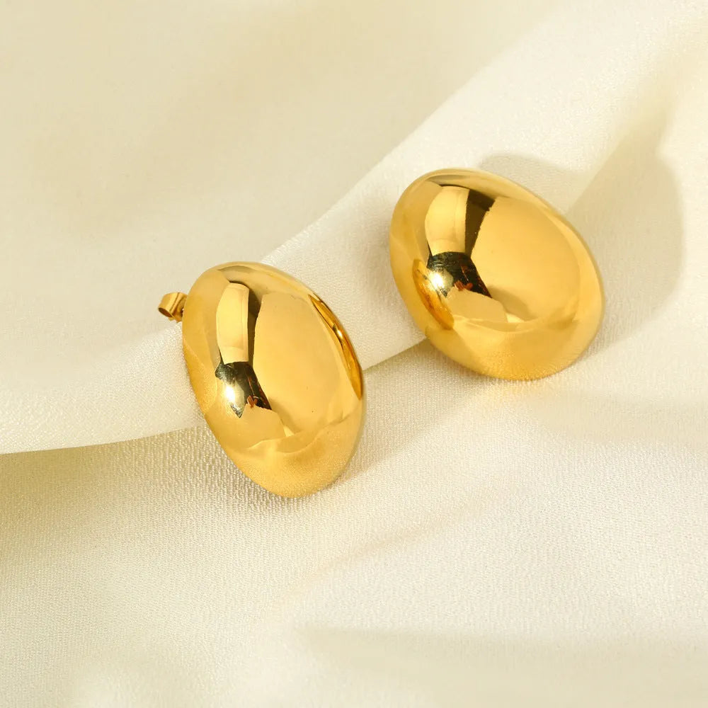 Geometric stainless steel ear studs with a glazed, reflective surface in colour DFE139.