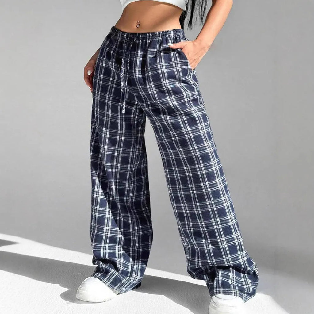 Blue plaid women's casual trousers with drawstring waist and pockets on a hanger.