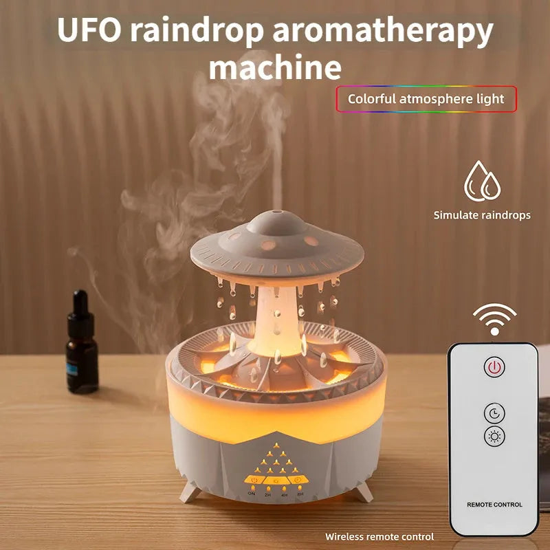 White cloud-shaped humidifier with water droplets and coloured lights on wooden surface