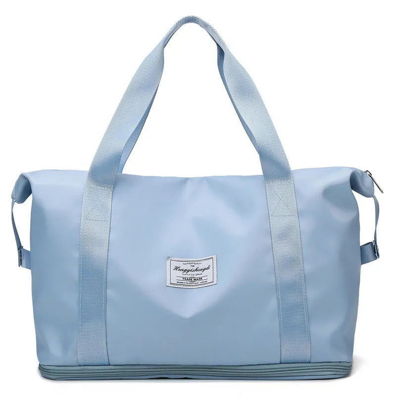 Large capacity Oxford cloth shoulder bag in lake green with multiple zippered pockets for travel