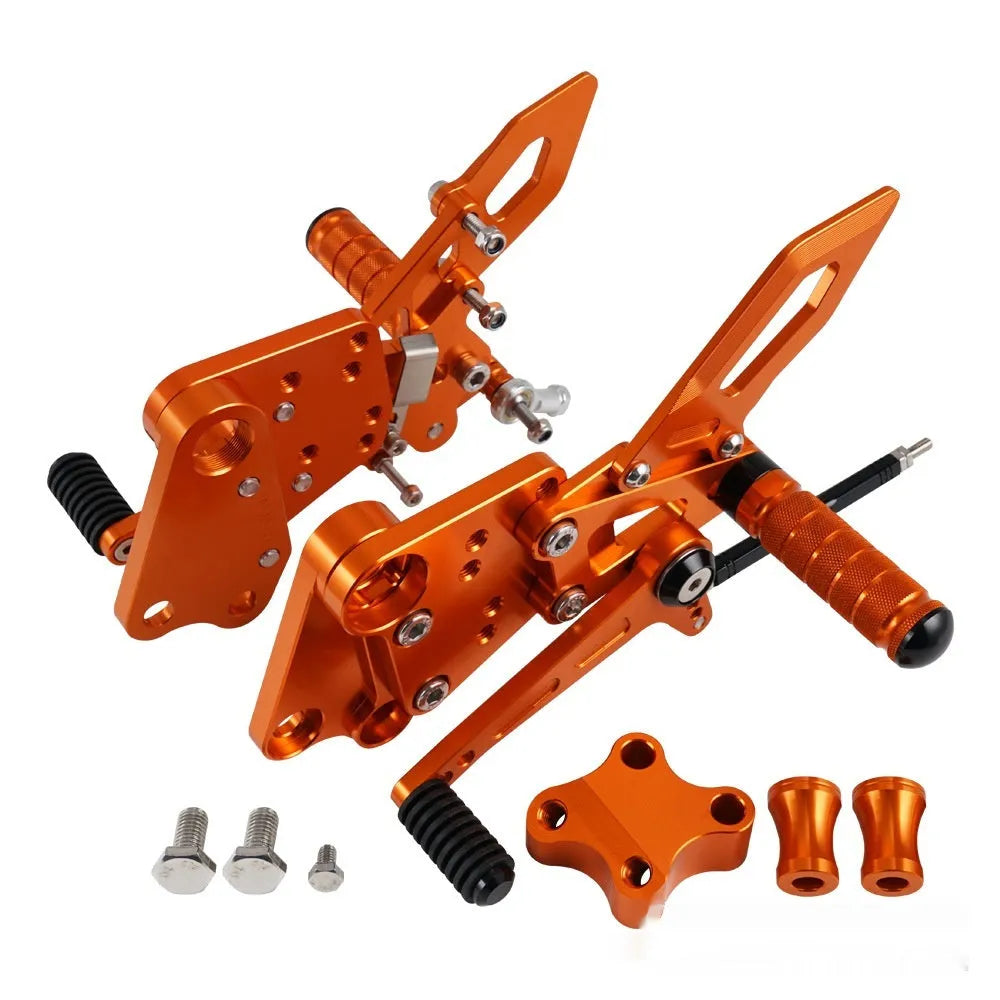 KTM Duke motorcycle raised footpeg support assembly in black and orange colours