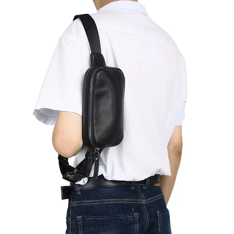 Men's small leather crossbody bag in black showing 17cm width dimensions