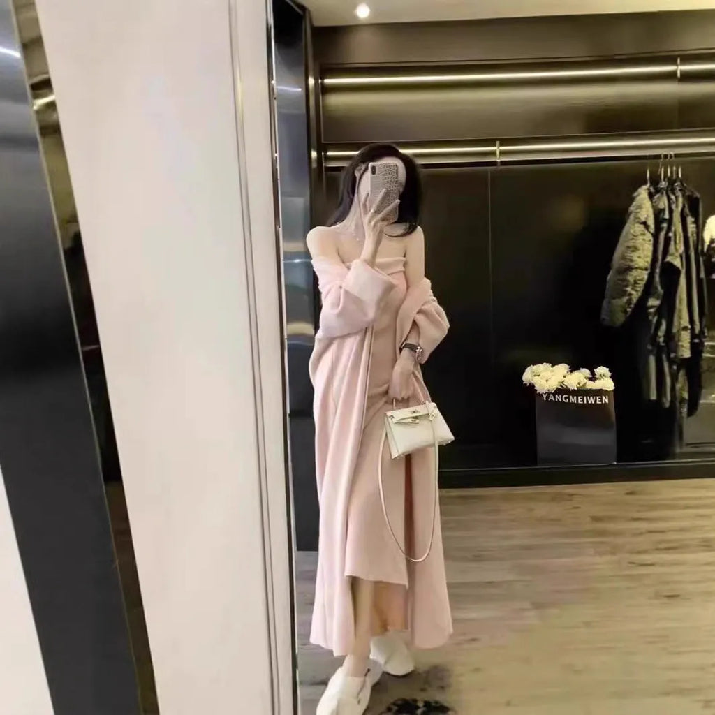 Women's grey knitted cardigan and long skirt two-piece set with flocking detail.