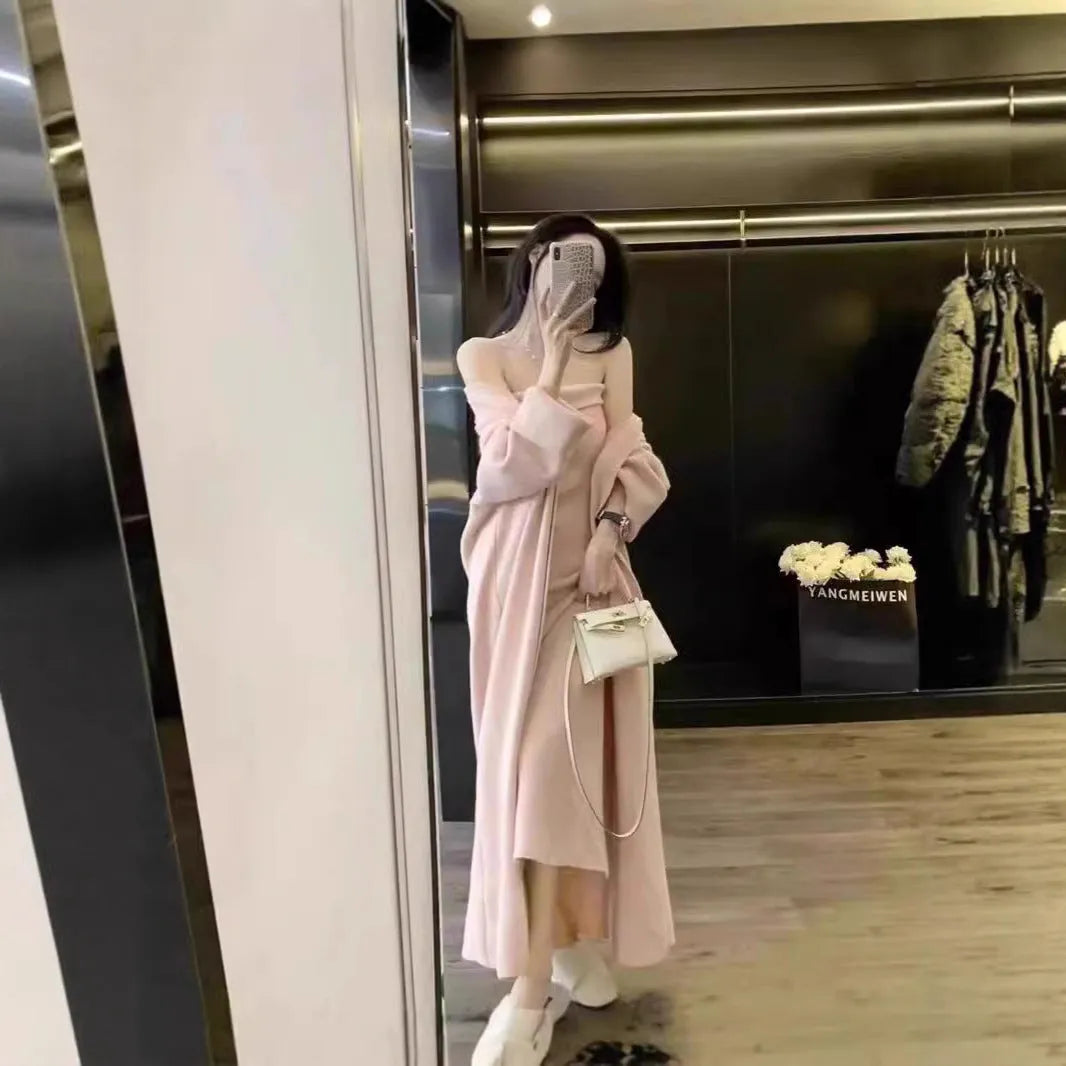 Women's grey knitted cardigan and long skirt two-piece set with flocking detail.