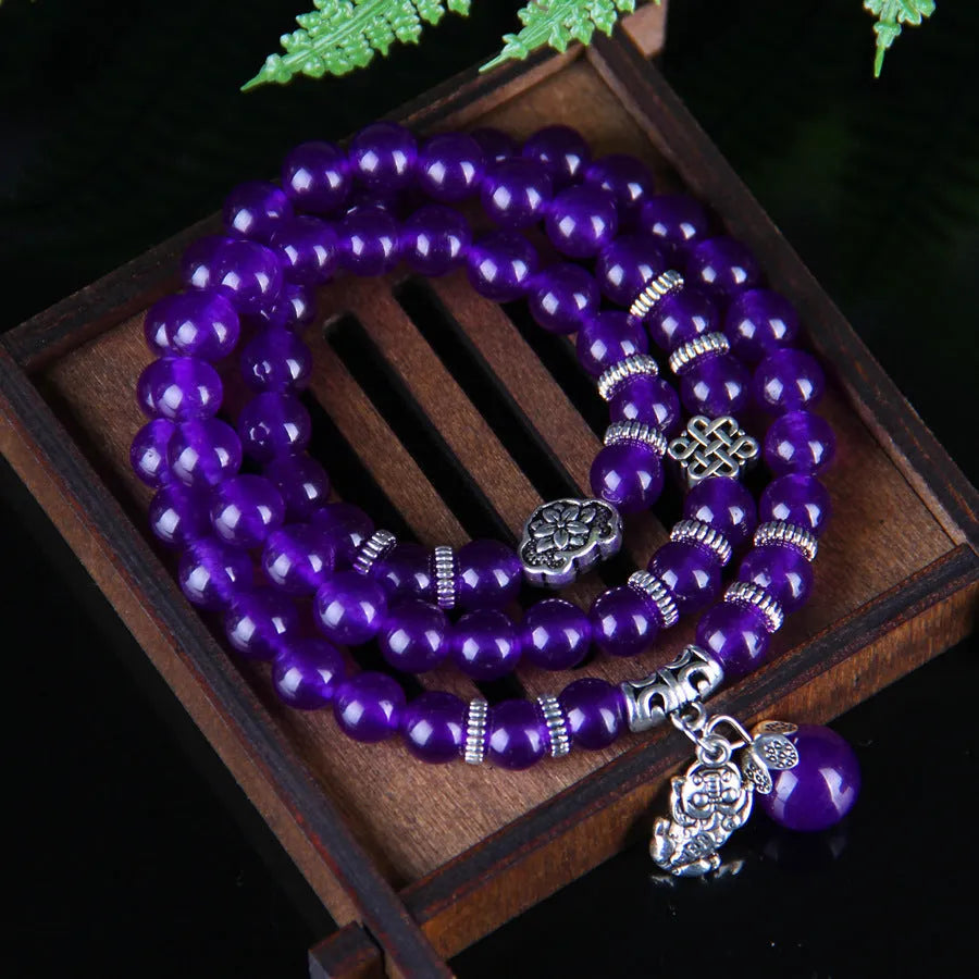 Purple ethnic-style women's bracelet with three circles of polished chalcedony beads on an adjustable band.