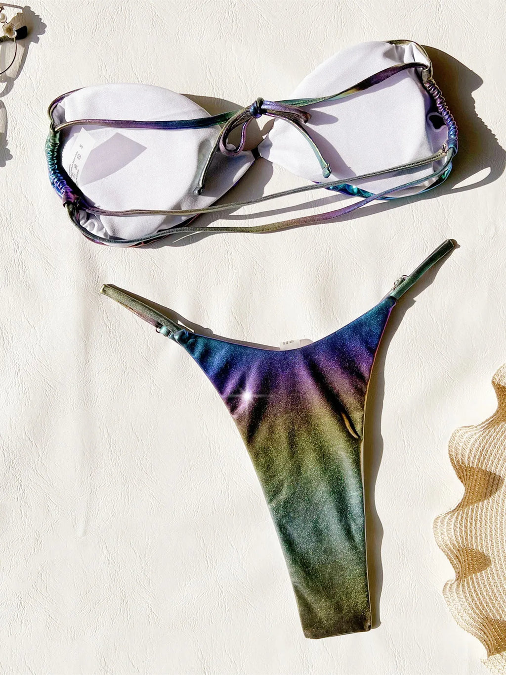 Women's purple gradient bikini swimsuit set made of polyester fabric.