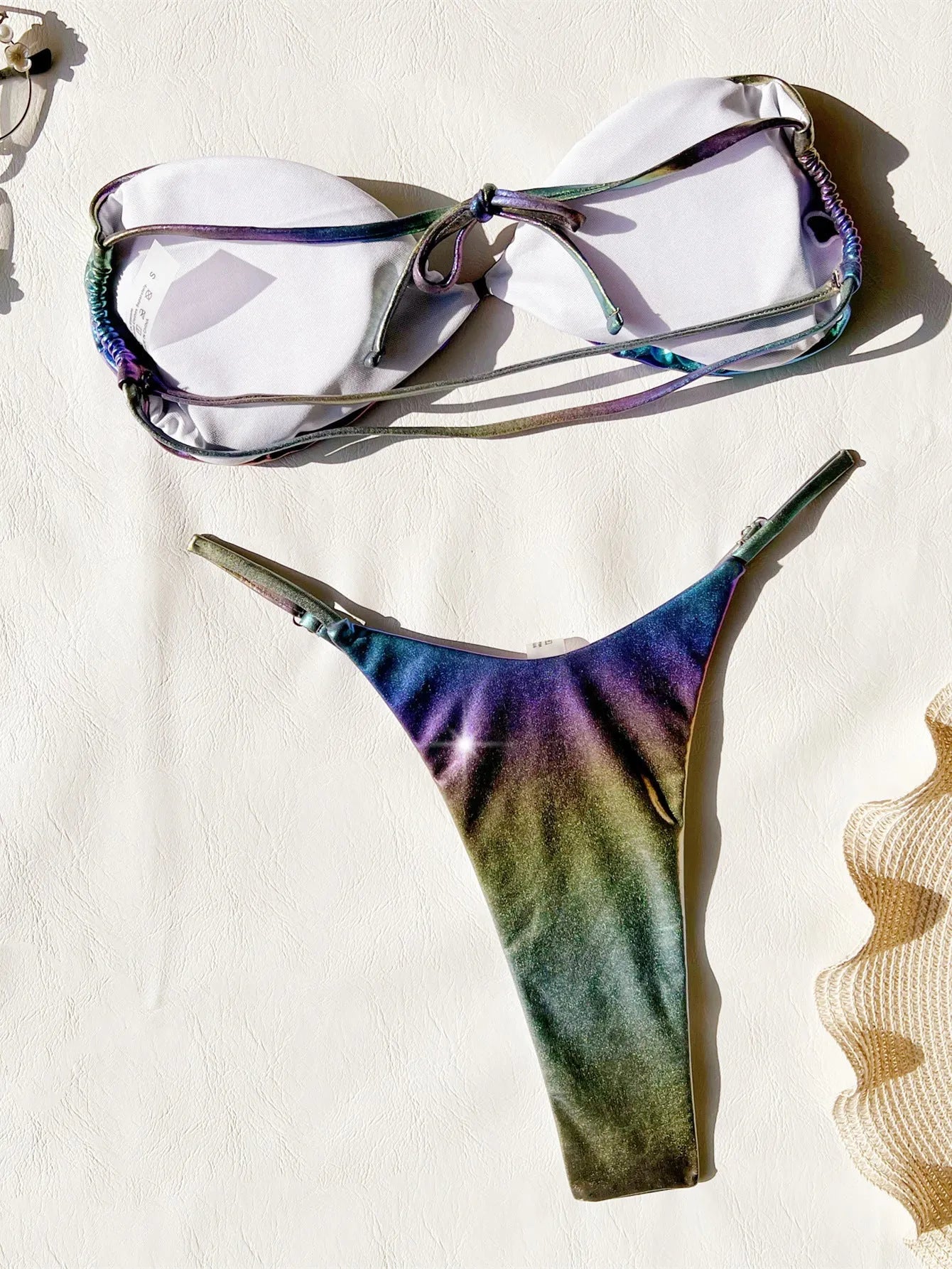 Women's purple gradient bikini swimsuit set made of polyester fabric.