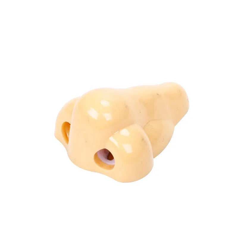 Geometry plastic pencil sharpener with big nostril opening in flesh colour measuring 58x45x30mm