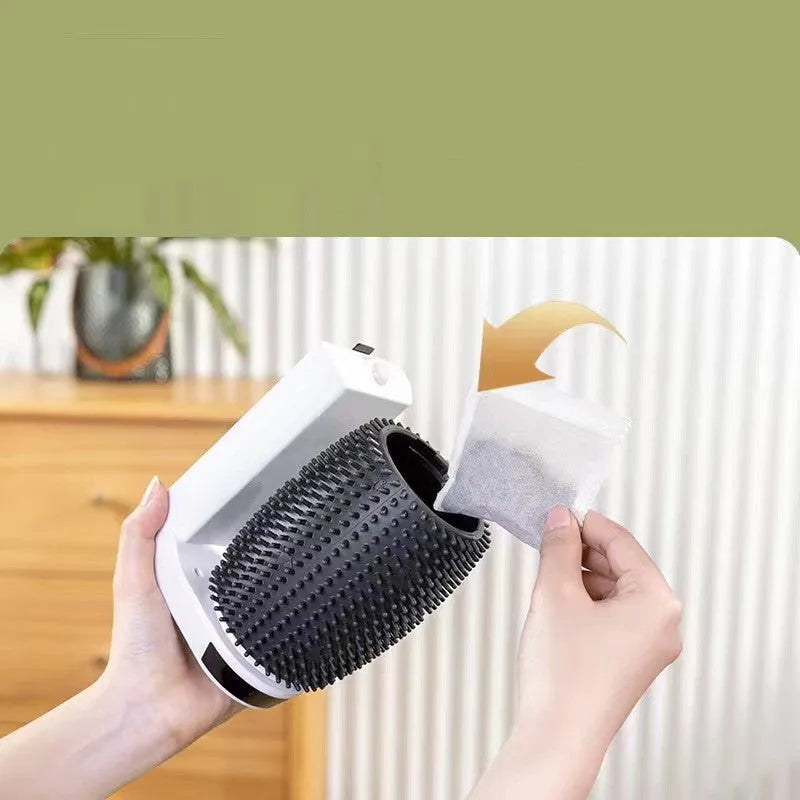 White automatic cat self-groomer brush mounted in a wall corner with soft silicone bristles.