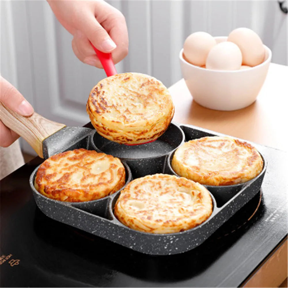 Aluminium four-hole non-stick frying pan with bakelite handle, silicone spatula, and oil brush