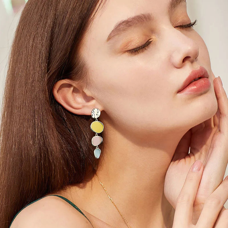 Morandi three-colour dripping oil finish alloy disc earrings on a sterling silver post.