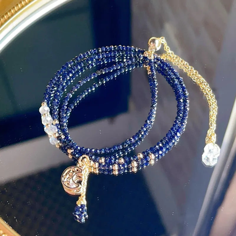Blue gold three-ring women's bracelet with blue sand stone gemstone on adjustable fastening