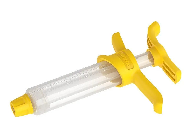 EZmtb bicycle hydraulic brake bleed kit with syringes, bottles, hoses, and metal adapters on a workbench.