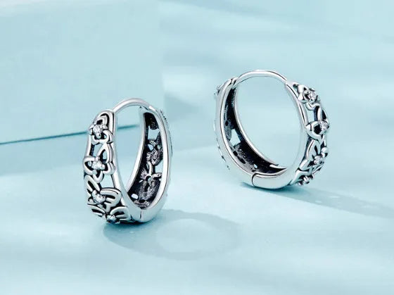 Retro hollow butterfly zircon earrings in sterling silver measuring 14mm by 5mm