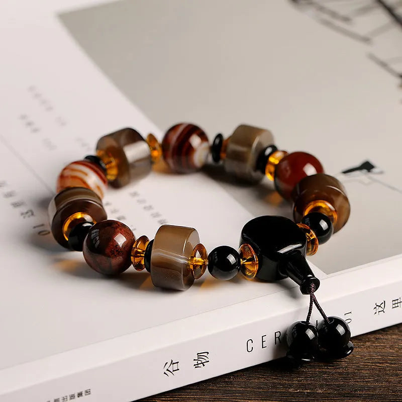Old agate bracelet with A13 sardonyx bead, white agate spacers, and red agate barrel bead in geometric ethnic design