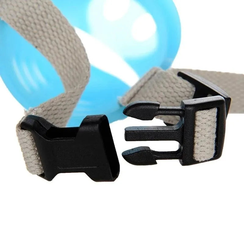 Green silicone anti-bite mouth cover muzzle for a long-mouthed dog on a white background.