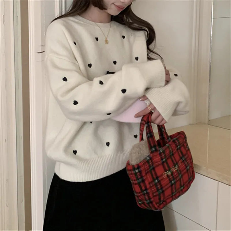 Women's loose grey acrylic pullover sweater with love-pattern embroidery on the front.