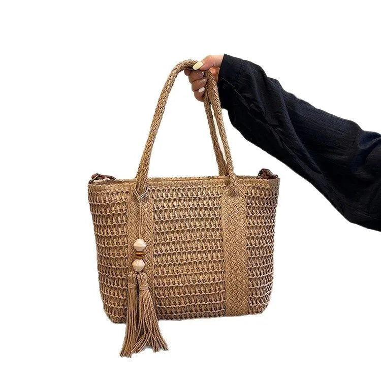Women's straw crossbody shoulder bag with woven texture in milky white colour showing large capacity interior