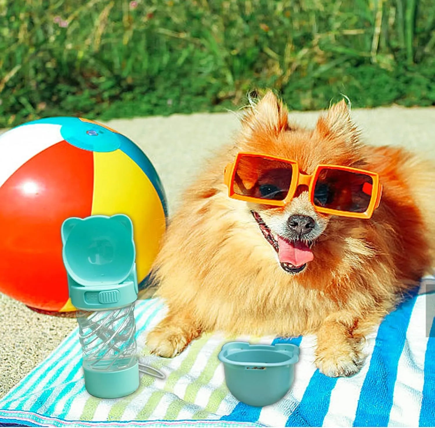 Green 3-in-1 portable pet water bottle with attached bowl, food container, and waste bag dispenser.