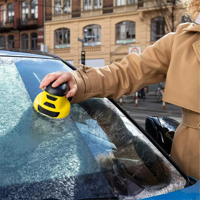 Yellow cordless electric ice scraper with funnel-shaped head next to a USB charging cable.